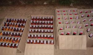 Ratusan botol miras berlabel ilegal yang diamankan Satgas pamtas – Surya Papua/IST