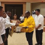Bupati Merauke, Romanus Mbaraka sedang menyerahkan SK PNS kepada tiga perwakilan – Surya Papua/Frans Kobun