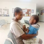 Mina, seorang ibu di Asiki sedang membawa anaknya untuk berobat – Surya Papua/IST
