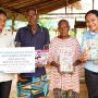 Pemberian buku pelajaran bagi anak didik SD di dua kampung di Distrik Jair, Kabupaten Boven Digoel – Surya Papua/IST