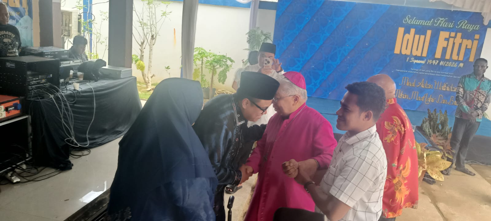 Suami Wabup Merauke, Gus Adib Fuat sedang bersalaman dengan Uskup Mandagi