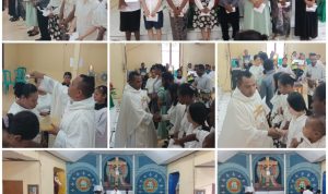 rekor Proses penerimaan 8 warga Protestan serta dua orang dewasa dipermandikan dalam perayaan misa di Gereja Santa Theresia Buti-Merauke – Surya Papua/Frans Kobun