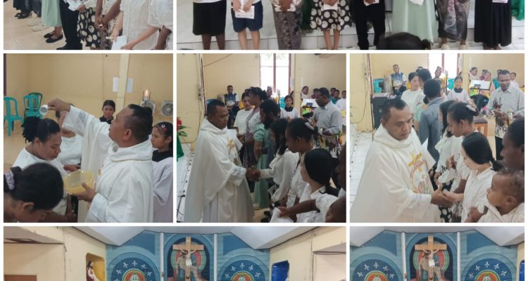 Proses penerimaan 8 warga Protestan serta dua orang dewasa dipermandikan dalam perayaan misa di Gereja Santa Theresia Buti-Merauke – Surya Papua/Frans Kobun