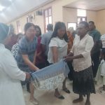 Sumbangan sukarela yang diberikan umat di Paroki Santa Theresia Buti usai perayaan misa – Surya Papua/Frans Kobun